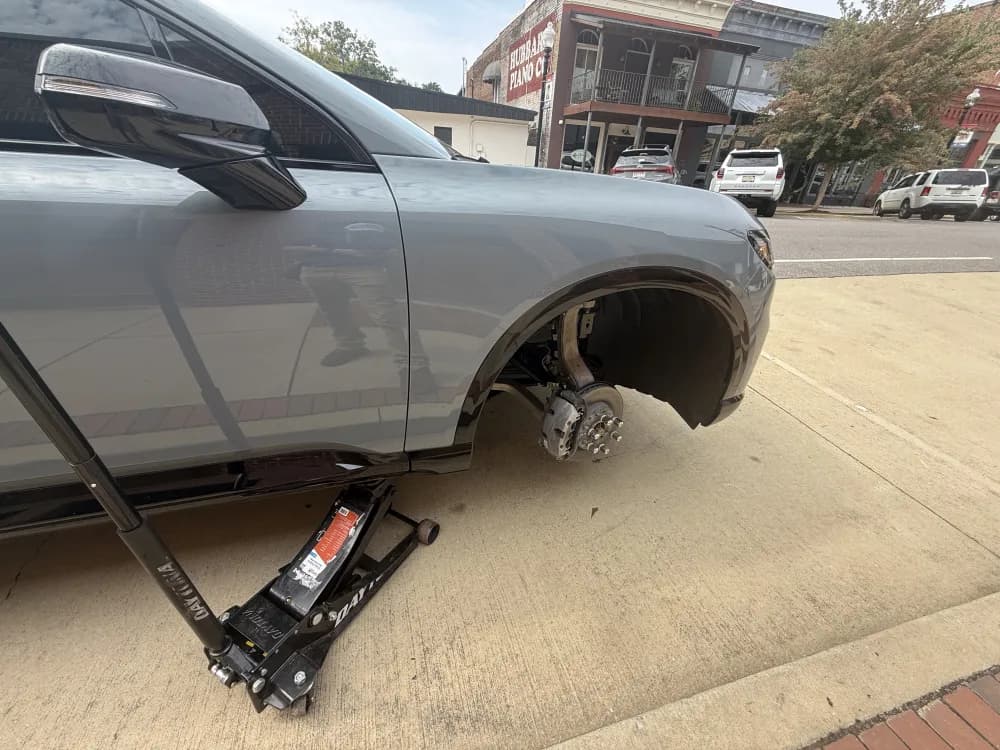 Wheel service on a jack in downtown Oxford, Alabama